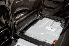 The Jeep® Wrangler 4xe's 400-volt, 17kWh battery pack mounts beneath the second-row seat, where it is protected from outside elements.