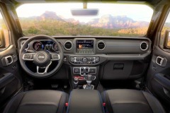 Interior of the 2021 Jeep® Wrangler Rubicon 4xe includes Surf Blue accent stitching on seats and interior trim.