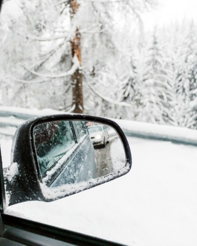 Side mirror in snow; Photo by Emilia Morariu on Unsplash