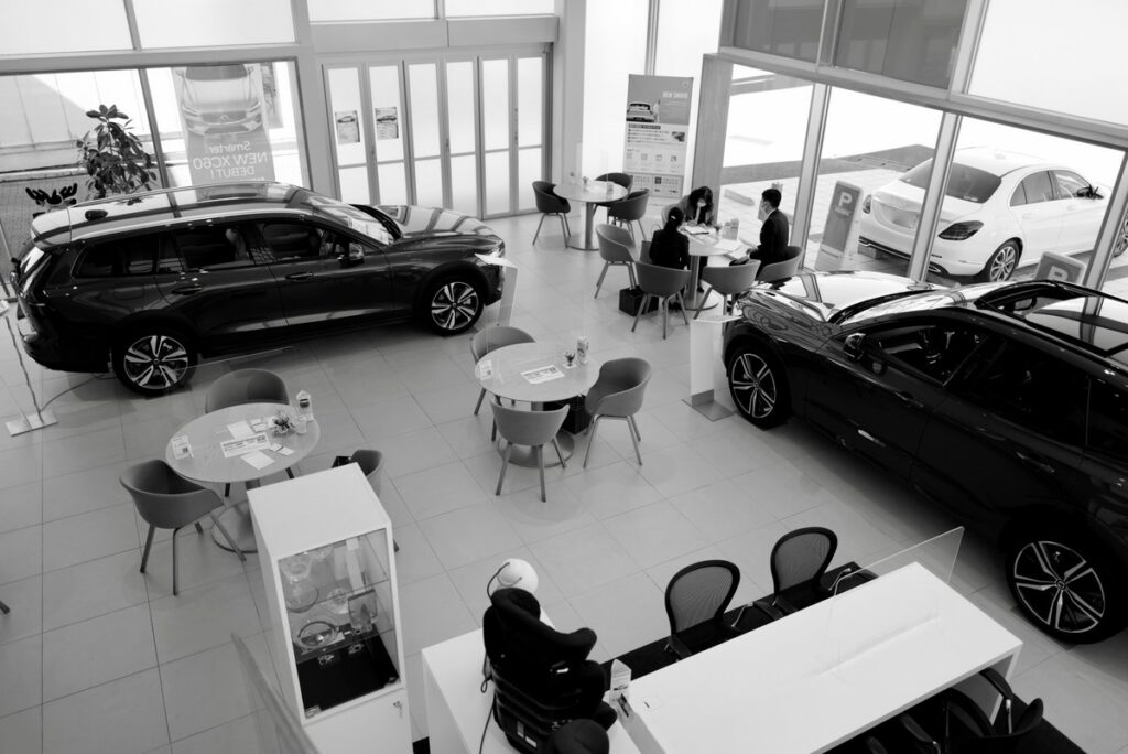 Photo by Kazuo ota on Unsplash; car dealership