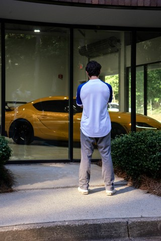 Photo by Rama Singh on Unsplash; outside car dealership