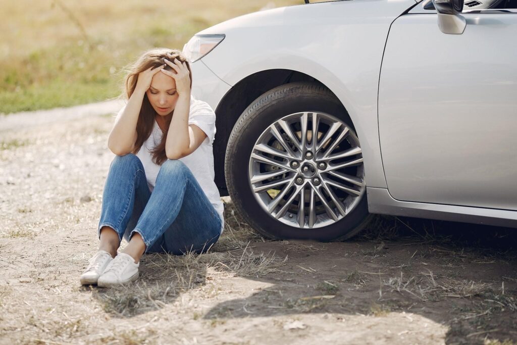 Image source: https://www.pexels.com/photo/worried-young-woman-sitting-near-broken-automobile-at-roadside-in-countryside-4173090/